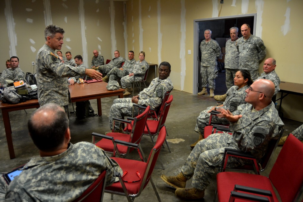GEORGIA NATIONAL GUARD CENTER, Rome, June 6, 2015 – Capt. Hayden Collins, the Executive Officer of 1st Battalion, 1st Brigade, Georgia State Defense Force (GSDF) conducts a brief After Action Report with Soldiers of 1st and 4th Battalion about the morning missions during Defender Northwest Georgia Field Training Exercise (FTX) 2015. This report, along with others gathered throughout the FTX, will determine the training the Soldiers will do during future drills. The FTX tests the capabilities of the Soldiers and staff of the GSDF in their ability to respond to a disaster. (Georgia State Defense Force photo by Master Sgt. Mark D. Woelzlein, Public Affairs Office)