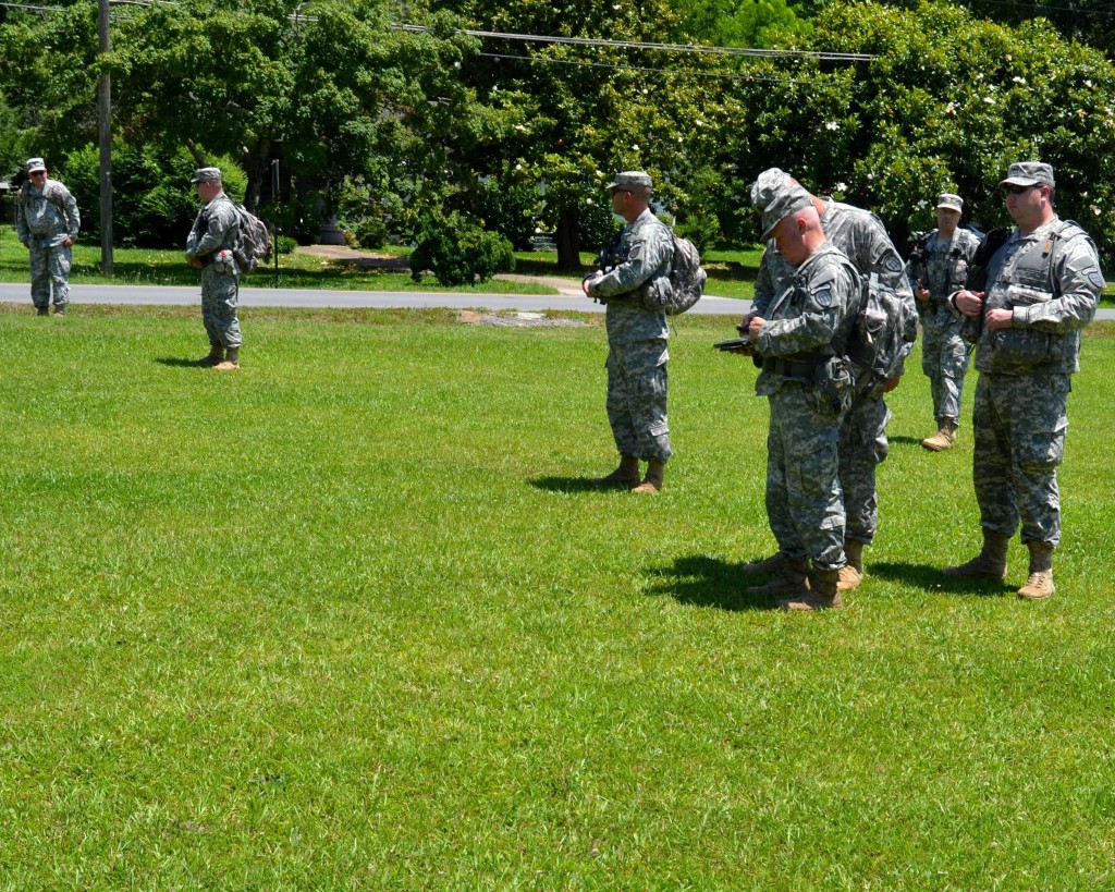 ETOWAH PARK, Rome, June 6, 2015 – Led by Staff Sgt. Corey Ranic, Soldiers of the combined Search and Rescue Teams of the 1st and 4th Battalion, 1st Brigade, Georgia State Defense Force (GSDF) pause and record items found during Defender Northwest Georgia Field Training Exercise (FTX) 2015. Staff Sgt. Ranic and his team is conducting a search for evidence that a tornado survivor passed through the area. The FTX tests the capabilities of the Soldiers and staff of the GSDF in their ability to respond to a disaster. (Georgia State Defense Force photo by Master Sgt. Mark D. Woelzlein, Public Affairs Office)