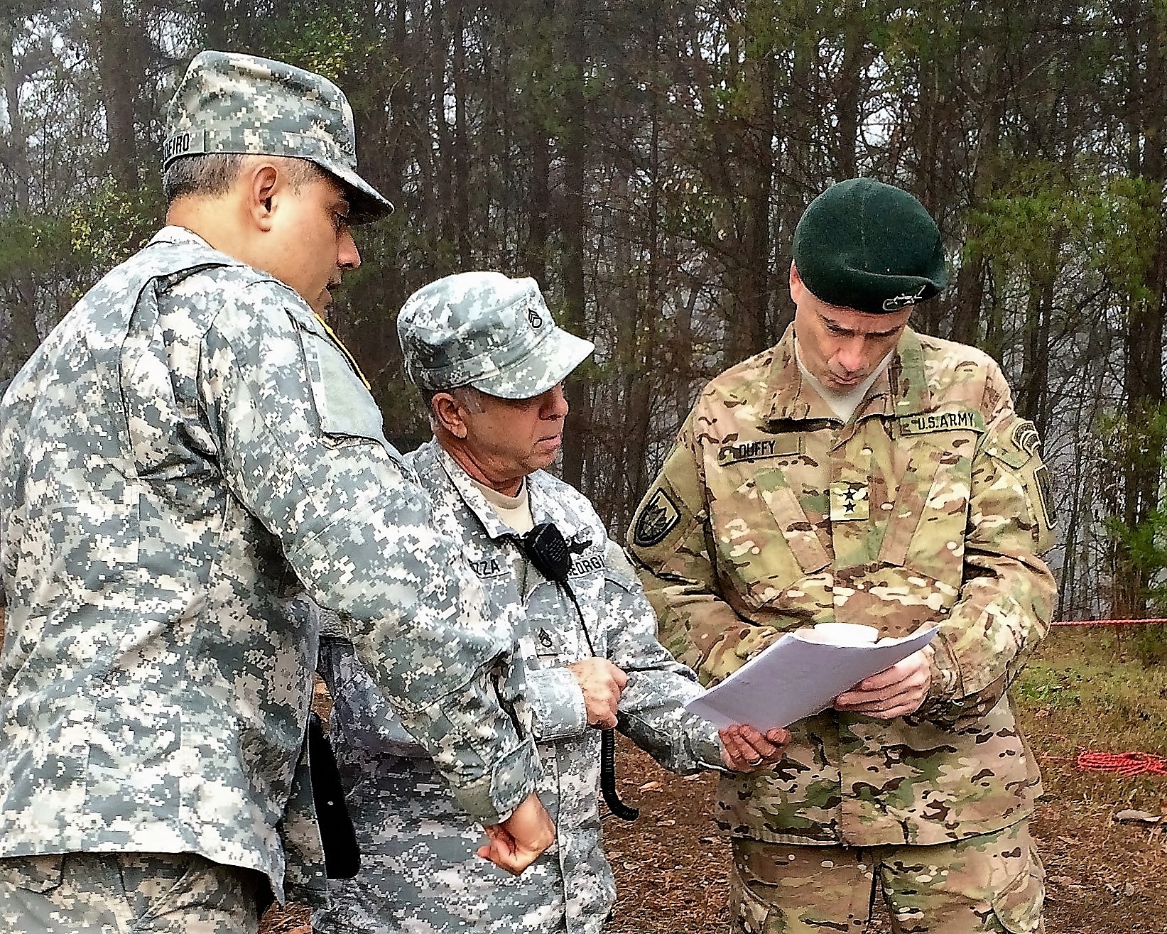 GEORGIA NATIONAL CEMETERY, Canton, Georgia, December 12, 2015 – Capt. Anazion Cordeiro (left) and Staff Sgt. Richard Carrozza (center) provide an overview of Georgia State Defense Force operations to Maj. Gen. William F. Duffy (right). (Georgia State Defense Force photo by Pvt. Michael Chapman, Public Affairs Office)