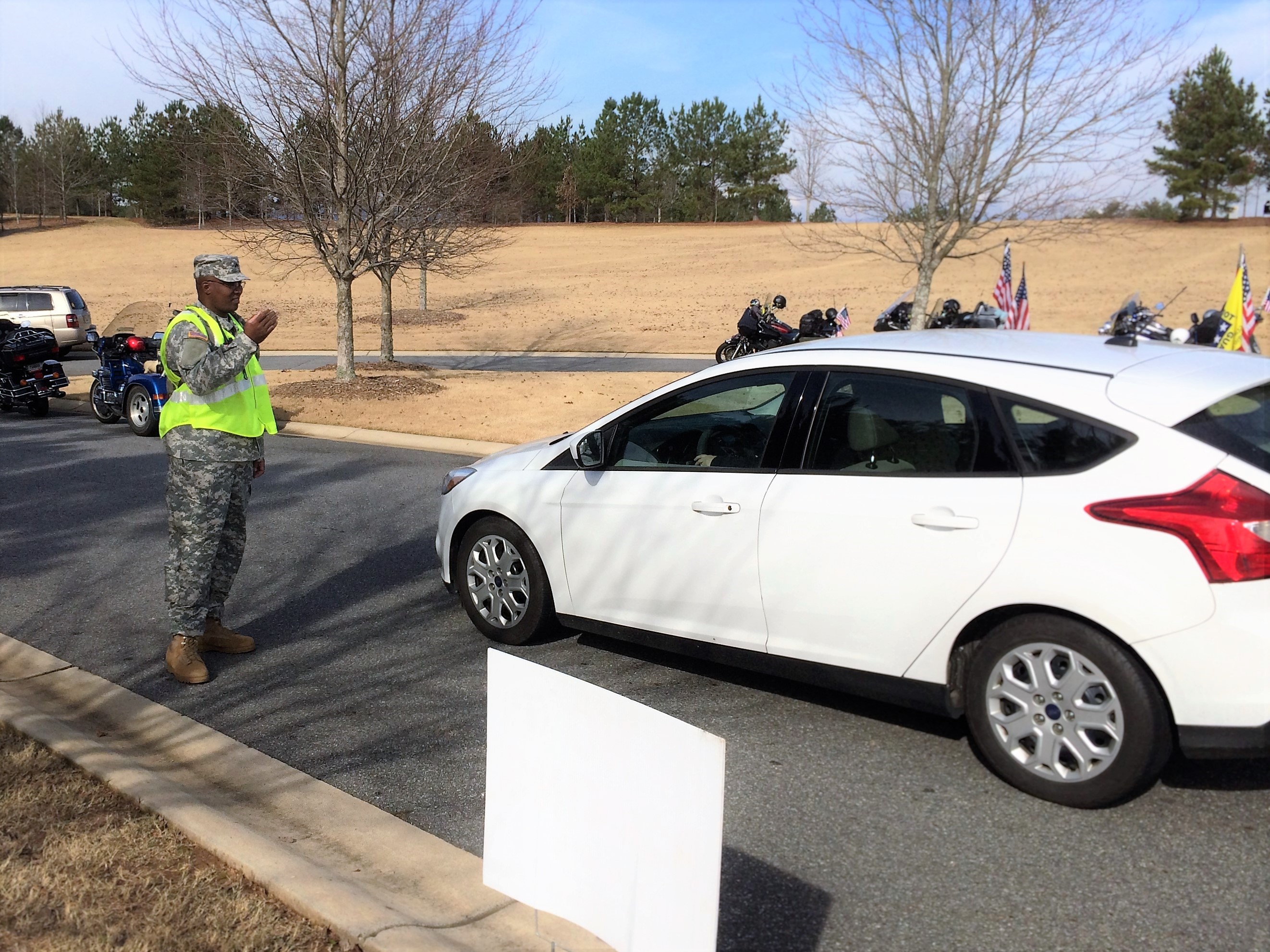 GEORGIA NATIONAL CEMETERY, Canton, Georgia, December 12, 2015 – Cpl. Robert Williams from 1st Brigade directs traffic during the event. (Georgia State Defense Force photo by Pvt. Michael Chapman, Public Affairs Office)
