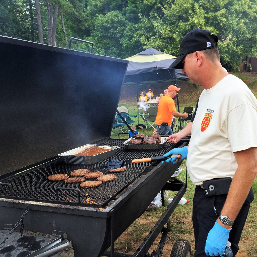 DOBBINS ARB, Marietta, Georgia, August 9, 2015 – A Soldier from the 76th Support Brigade cooks food at the GAARNG 78th Aviation Troop Command Family Day event.
