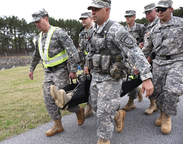 LAKE LANIER, Buford, Ga. March 19, 2016 – Georgia State Defense Force Soldiers carry a victim-role-player of a mock airplane crash to the triage staging area during the Lake Lanier Search and Rescue Exercise. The GSDF, Civil Air Patrol, and United States Coast Guard Auxiliary participated in the Multi-Agency Search and Rescue Mission. - Georgia State Defense Force photo by Pfc. Davidson