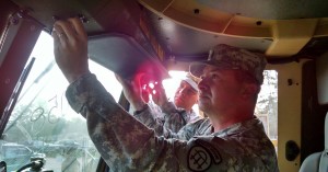 SGT Chris Treadwell and WO1 Howard Seay assist in pre-convoy maintenance and troubleshooting of M1088 trucks.