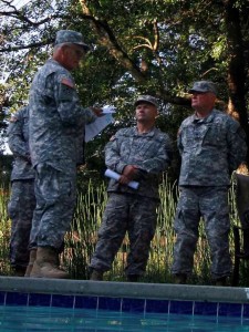 CW4 Lloyd Garrard briefs GSDF Soldiers with SAFE principle during the initial portion of the water survival training class.